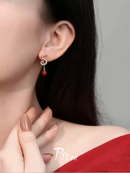 Silver snake-shaped ruby Earrings - Bad Luck Banisher
