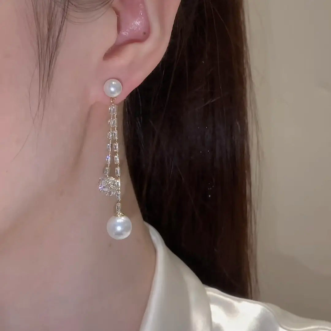 Long pendant pearl earrings