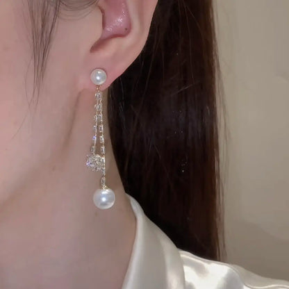 Long pendant pearl earrings