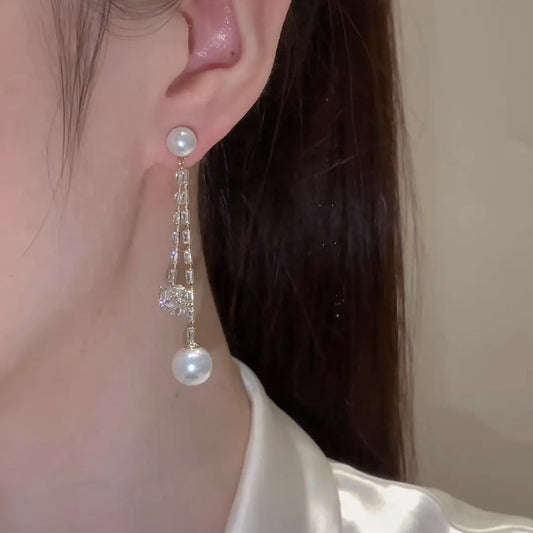 Long pendant pearl earrings